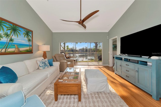 living room featuring lofted ceiling, ceiling fan, and light hardwood / wood-style floors