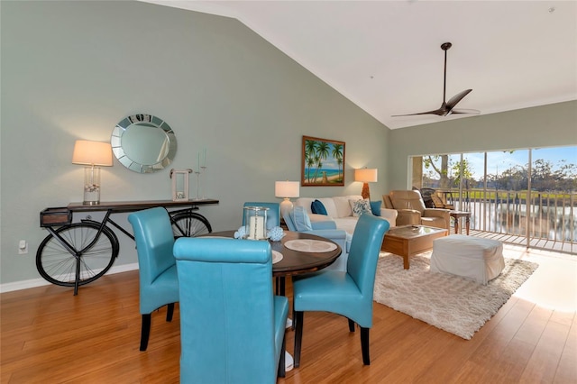 dining area with lofted ceiling, ceiling fan, and light hardwood / wood-style floors