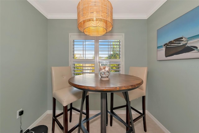 tiled dining room with crown molding