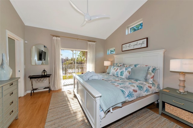 bedroom featuring lofted ceiling, light hardwood / wood-style floors, ceiling fan, and access to outside