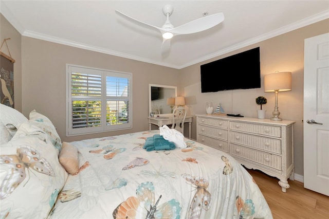 bedroom featuring ceiling fan, light hardwood / wood-style flooring, and crown molding