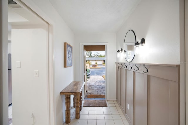 doorway to outside featuring light tile patterned floors