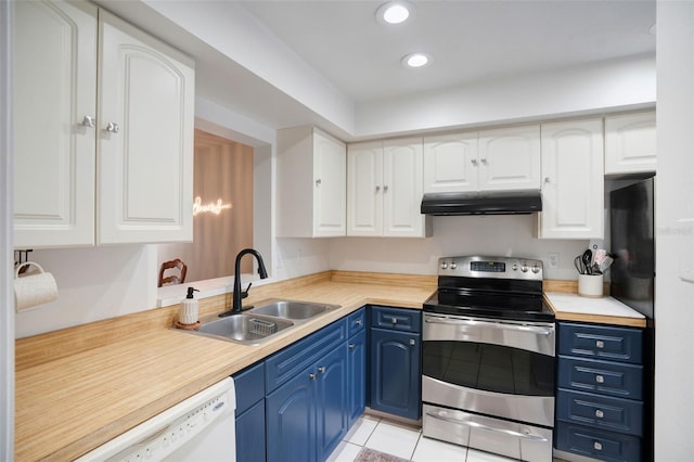 kitchen featuring electric range, white cabinets, and blue cabinets