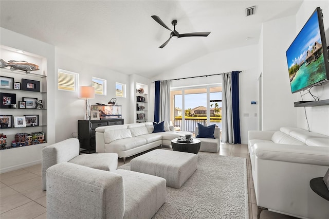 living room with lofted ceiling, light tile patterned floors, built in features, and ceiling fan