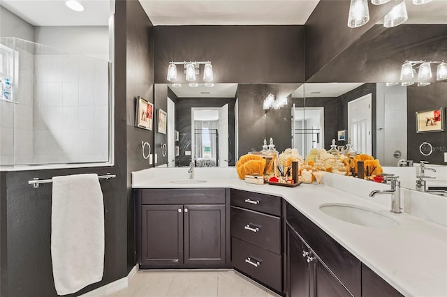 bathroom with walk in shower, tile patterned floors, and vanity