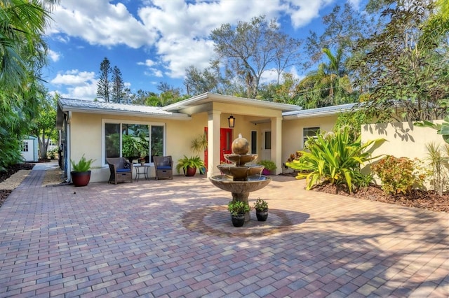 back of house featuring a patio area