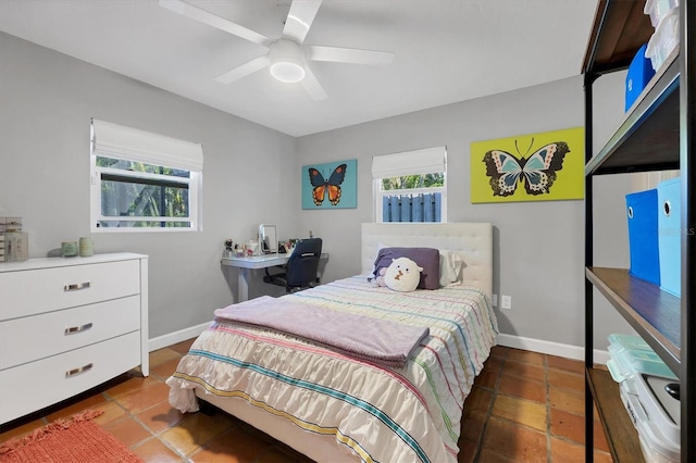 bedroom featuring ceiling fan and tile patterned floors