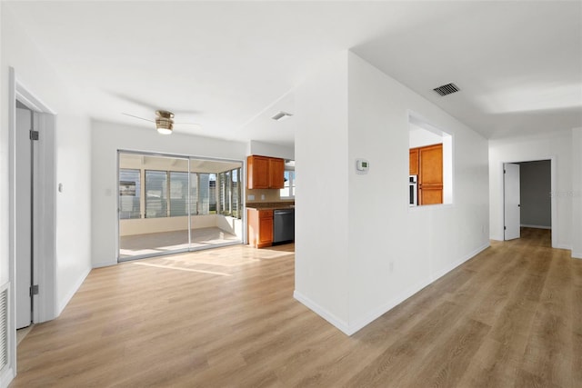 unfurnished living room featuring ceiling fan and light hardwood / wood-style flooring