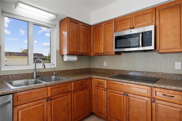 kitchen featuring stainless steel appliances and sink