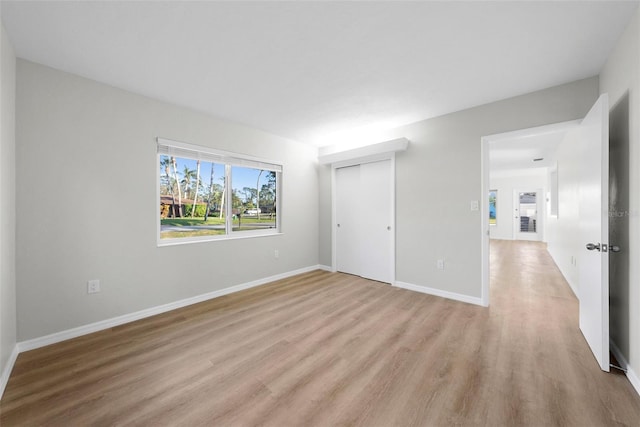 unfurnished room featuring light hardwood / wood-style floors