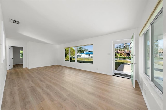 unfurnished living room featuring light wood-type flooring