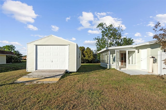 garage with a lawn