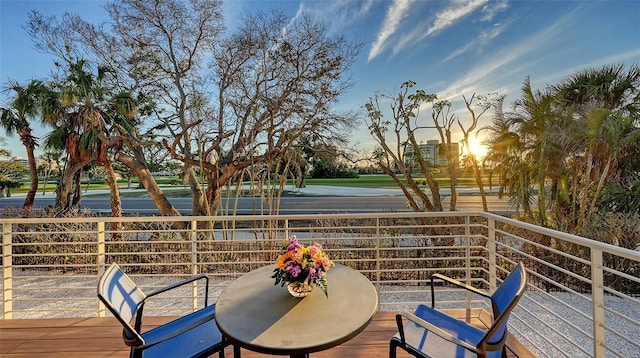 view of balcony at dusk