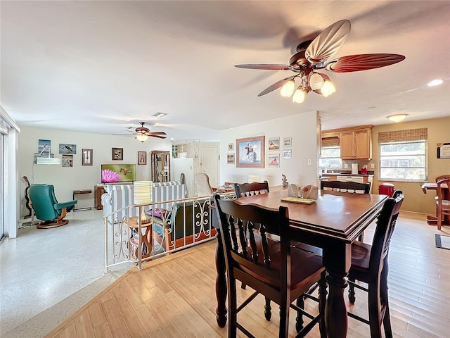 dining area featuring ceiling fan and light hardwood / wood-style flooring