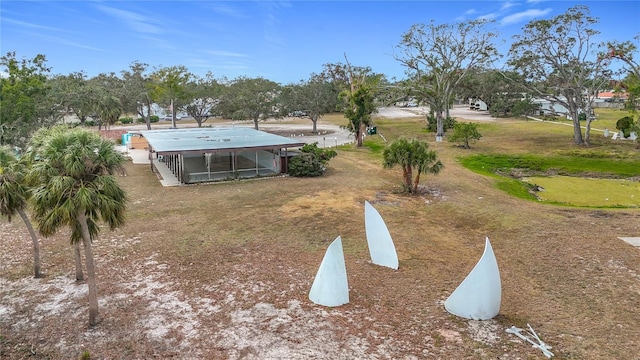 view of yard with a sunroom