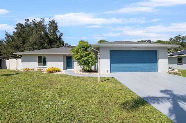 single story home with a garage and a front lawn