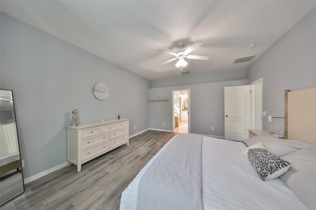 bedroom with ceiling fan and light hardwood / wood-style flooring