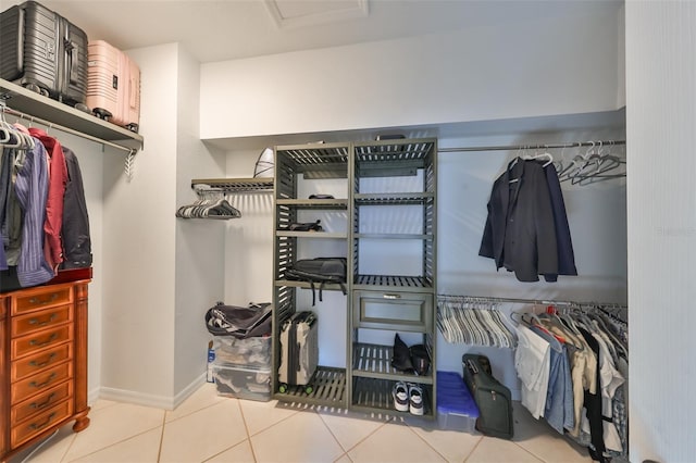 spacious closet with light tile patterned flooring