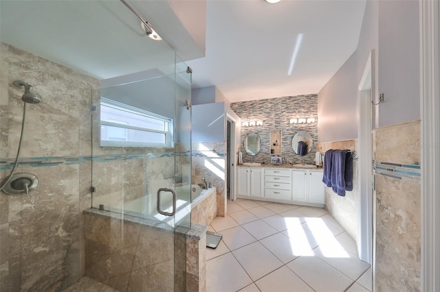 bathroom with tasteful backsplash, separate shower and tub, vanity, and tile patterned floors