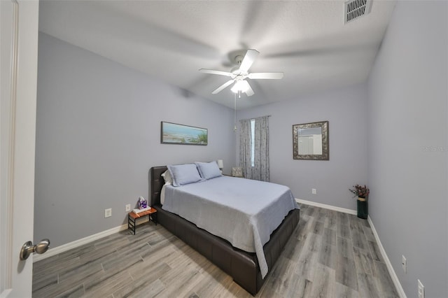 bedroom featuring ceiling fan and light wood-type flooring