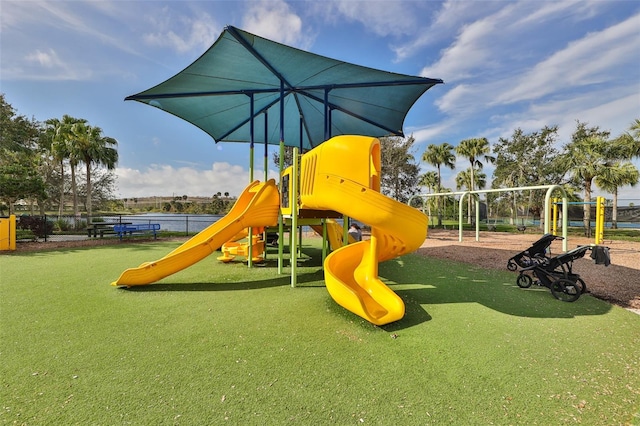 view of jungle gym with a water view