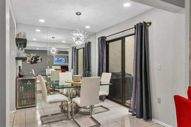 tiled dining room featuring a chandelier and wine cooler