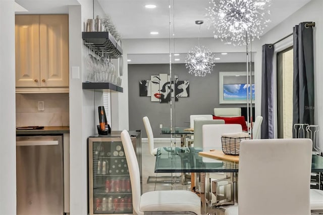 dining area with an inviting chandelier and beverage cooler