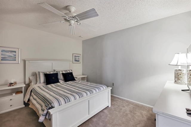 carpeted bedroom with ceiling fan and a textured ceiling