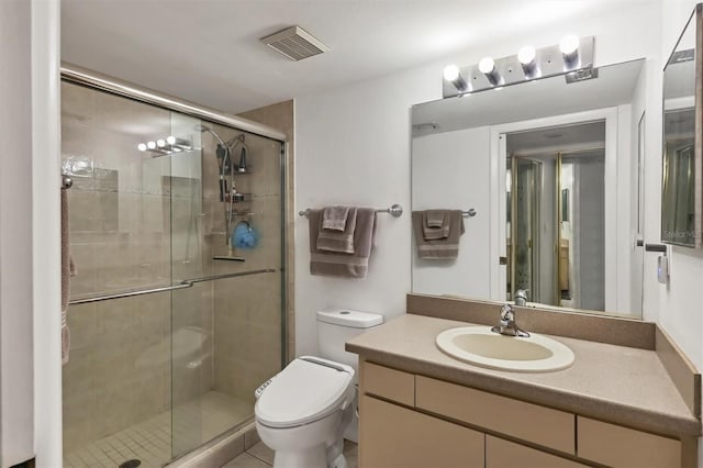 bathroom featuring toilet, walk in shower, and vanity