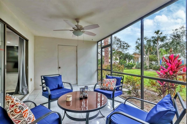 sunroom featuring ceiling fan