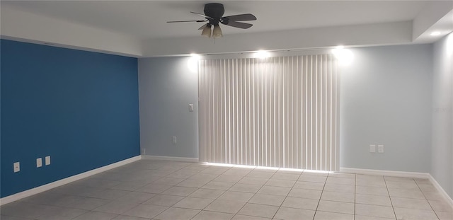 unfurnished room featuring ceiling fan and light tile patterned floors