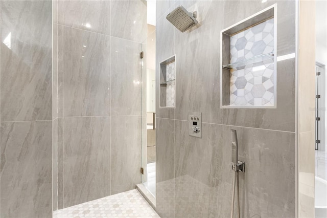 bathroom featuring tiled shower