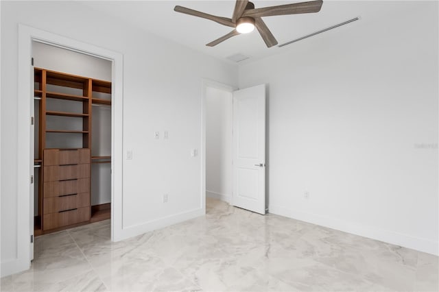 unfurnished bedroom featuring ceiling fan and a closet