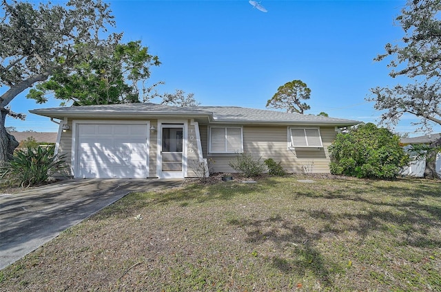 single story home with a garage and a front lawn