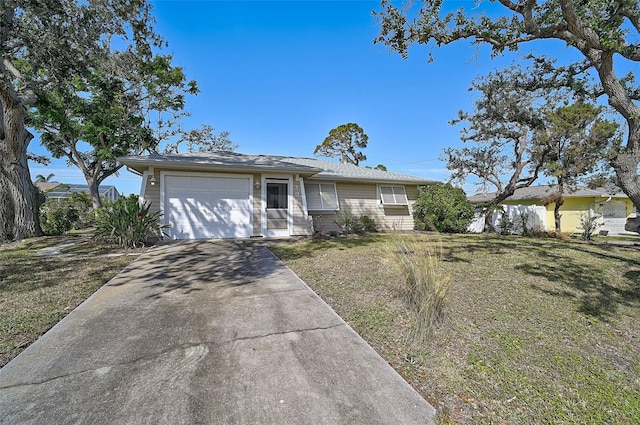 ranch-style home with a garage and a front yard