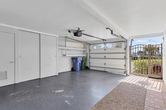 garage featuring a garage door opener