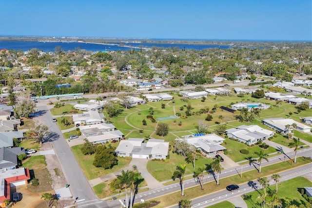 drone / aerial view featuring a water view and a residential view