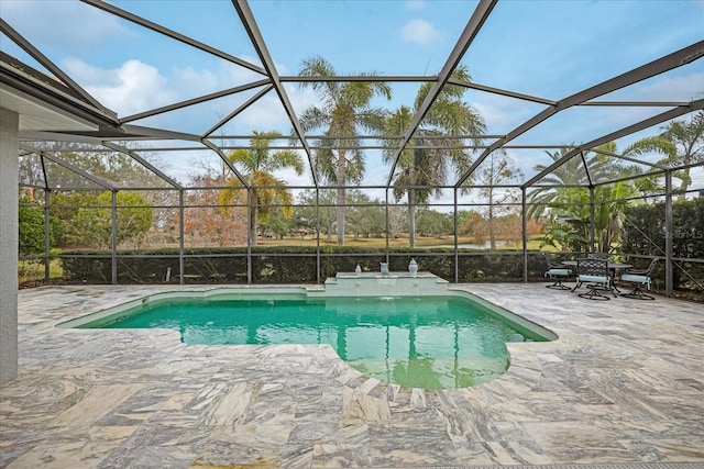 view of swimming pool with a lanai, pool water feature, and a patio