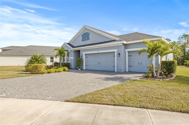 ranch-style house featuring a front yard and a garage