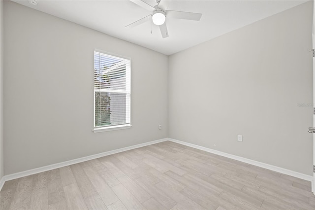 empty room featuring ceiling fan and light hardwood / wood-style flooring