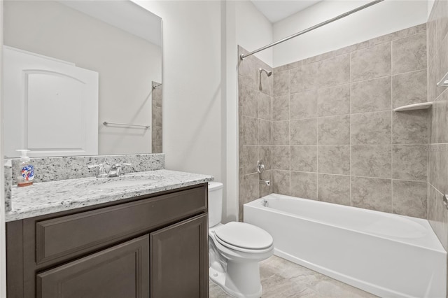 bathroom with washtub / shower combination, toilet, and vanity