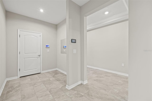 entrance foyer featuring marble finish floor, baseboards, and recessed lighting