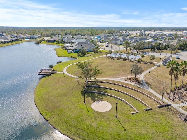 aerial view with a residential view and a water view