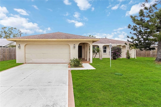 view of front facade with a garage and a front yard