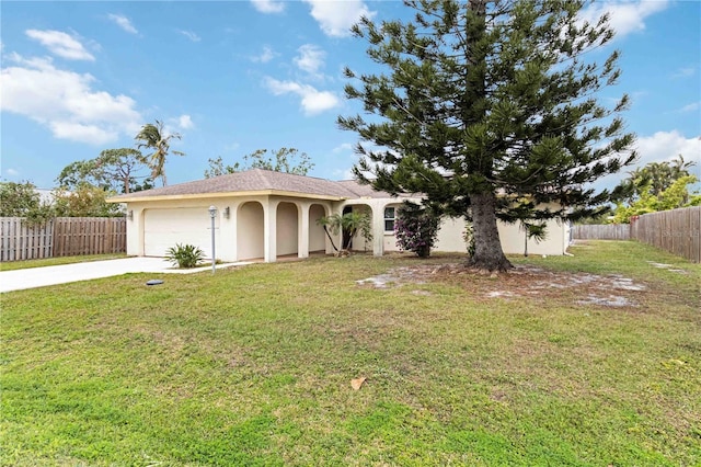 view of front of property with a front lawn and a garage