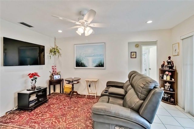 living room with ceiling fan and light tile patterned flooring