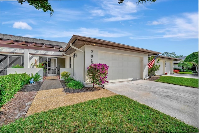 ranch-style home featuring a garage