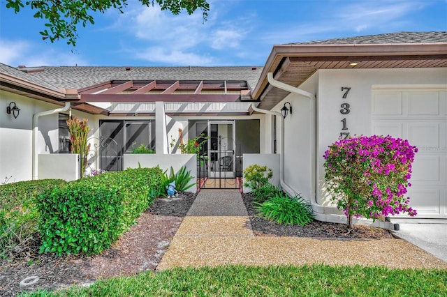 doorway to property featuring a garage