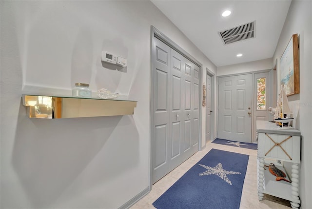 doorway featuring light tile patterned floors