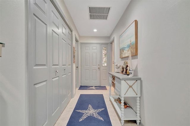 entryway featuring light tile patterned flooring